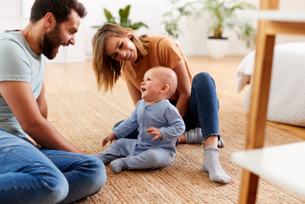 Two parents are implementing positive guidance with their child